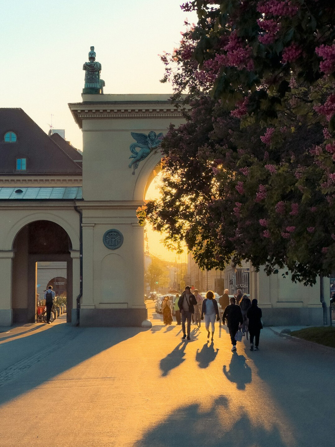 person walking on city street at dusk