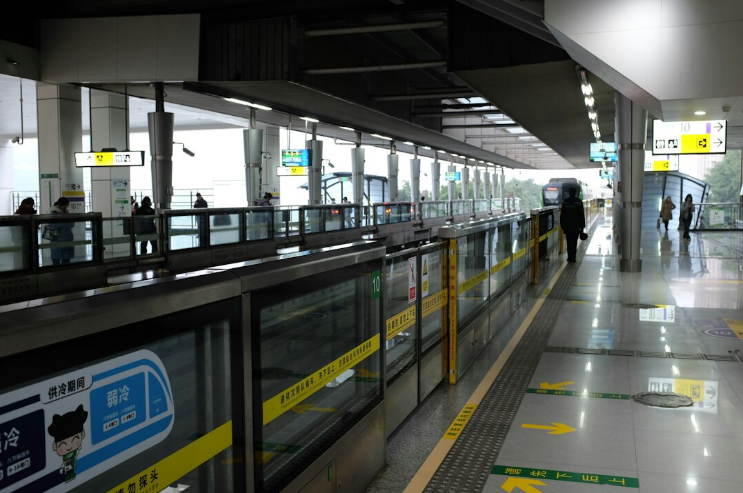 Commuters waiting on a subway platform in a modern city