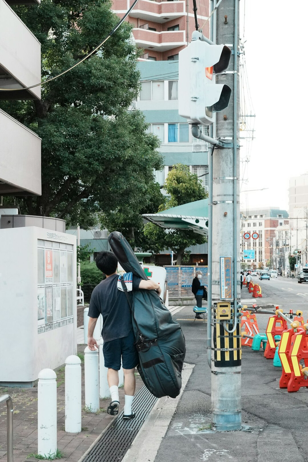 street musician performing on sidewalk