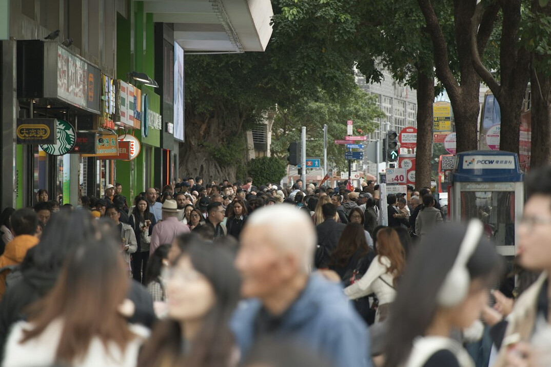 people walking on busy sidewalk